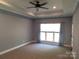 Large, bright bedroom featuring neutral walls and carpets; window allowing in natural light at 2127 Cedar Rd, York, SC 29745