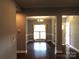 Cozy dining area with modern chandelier, light walls and dark wood flooring at 2127 Cedar Rd, York, SC 29745
