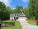 Inviting single-Gathering home with a well-manicured lawn, attached garage, and charming black mailbox at 2127 Cedar Rd, York, SC 29745