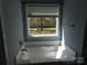 Soaking tub with outside view featuring large window letting in natural light at 2127 Cedar Rd, York, SC 29745