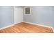 Bedroom featuring hardwood floors, a window and neutral walls at 2218 W Fifth Ave, Gastonia, NC 28052