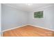 Cozy bedroom with hardwood floors and a window view at 2218 W Fifth Ave, Gastonia, NC 28052