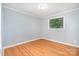 Bedroom features neutral walls and hardwood floors at 2218 W Fifth Ave, Gastonia, NC 28052