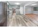Kitchen features gray cabinets, stainless steel appliances, and modern laminate flooring at 2218 W Fifth Ave, Gastonia, NC 28052
