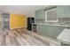 Open kitchen featuring modern appliances, tiled backsplash, and direct access to dining area at 2218 W Fifth Ave, Gastonia, NC 28052