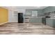 A updated kitchen with stainless steel appliances and refinished cabinets at 2218 W Fifth Ave, Gastonia, NC 28052