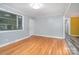 Spacious living room with hardwood floors and ample natural light perfect for entertaining at 2218 W Fifth Ave, Gastonia, NC 28052