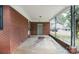 Covered front porch with brick columns on an older red brick home at 2218 W Fifth Ave, Gastonia, NC 28052