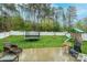 Backyard with a trampoline and play set, great for a Gathering at 236 Riley Dr, Taylorsville, NC 28681
