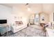Charming bedroom featuring a cozy sitting area, desk, and natural light from the window at 236 Riley Dr, Taylorsville, NC 28681