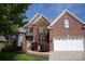Charming brick home with a two-car garage and well-maintained front yard at 236 Riley Dr, Taylorsville, NC 28681