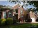 Traditional brick home with manicured lawn and landscaping, showcasing curb appeal at 236 Riley Dr, Taylorsville, NC 28681