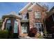 Brick home exterior features a front door with wreath and well-kept shrubbery at 236 Riley Dr, Taylorsville, NC 28681