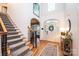 Bright foyer with hardwood floors, staircase, and arched doorways at 236 Riley Dr, Taylorsville, NC 28681