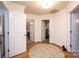 Bright hallway with hardwood floors that leads to different rooms at 236 Riley Dr, Taylorsville, NC 28681