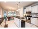 Stylish kitchen with white cabinets, stainless steel appliances, and a center island at 236 Riley Dr, Taylorsville, NC 28681