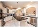Well-lit kitchen includes stainless steel appliances, island and white cabinetry at 236 Riley Dr, Taylorsville, NC 28681