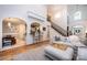 Spacious living room with hardwood floors, open layout, and staircase at 236 Riley Dr, Taylorsville, NC 28681