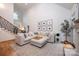 Bright, open living room with a large sectional sofa and ample natural light at 236 Riley Dr, Taylorsville, NC 28681