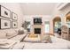 Cozy living room featuring a fireplace, large couch, and view of the backyard at 236 Riley Dr, Taylorsville, NC 28681
