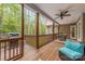 Spacious covered back deck with outdoor kitchen, ceiling fans, and comfortable seating overlooking a lush backyard at 2599 Highway 557 None, Clover, SC 29710