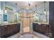 Elegant bathroom featuring dual granite vanities, a glass-enclosed shower, decorative lighting and pale-blue walls at 2599 Highway 557 None, Clover, SC 29710