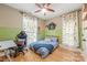 Charming bedroom featuring a modern ceiling fan, desk and chair, and light hardwood floors at 2599 Highway 557 None, Clover, SC 29710
