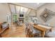 Bright living room featuring a stone fireplace, hardwood floors, and a dining area at 2599 Highway 557 None, Clover, SC 29710