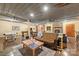 Open concept living room featuring a pool table, wood burning fireplace, and concrete floors at 2599 Highway 557 None, Clover, SC 29710