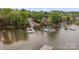 Aerial view of a lakefront property with multiple docks and boats, offering waterfront living at 263 Fernbrook Dr, Mooresville, NC 28117