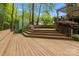 Wooden deck and bench seating in a private backyard setting, perfect for relaxing at 263 Fernbrook Dr, Mooresville, NC 28117