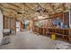 Unfinished basement featuring exposed beams, concrete floor, and electrical framework at 263 Fernbrook Dr, Mooresville, NC 28117