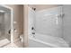 Bathroom featuring marble tiled shower and floors, a toilet and neutral-colored walls at 263 Fernbrook Dr, Mooresville, NC 28117