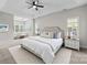 Spacious primary bedroom with tray ceiling, large windows, and a sitting area for a comfortable retreat at 263 Fernbrook Dr, Mooresville, NC 28117
