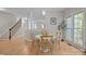Bright dining area near kitchen with access to upper level of house via a staircase, bathed in natural light at 263 Fernbrook Dr, Mooresville, NC 28117