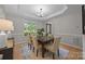 Dining room with hardwood floors, ample natural light, and views of the front yard at 263 Fernbrook Dr, Mooresville, NC 28117