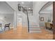 Grand foyer with hardwood floors, staircase, and elegant architectural details at 263 Fernbrook Dr, Mooresville, NC 28117