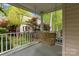 Charming front porch with a wooden swing, offering a relaxing spot to enjoy the outdoors at 263 Fernbrook Dr, Mooresville, NC 28117