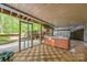 Relax under a covered porch next to a hot tub with screened in windows to enjoy backyard views at 263 Fernbrook Dr, Mooresville, NC 28117