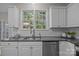 Well-appointed kitchen with stainless steel appliances, granite countertops, and white cabinets for a modern feel at 263 Fernbrook Dr, Mooresville, NC 28117