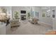Sunlit living room with a cozy fireplace, neutral carpet and light gray colored walls at 263 Fernbrook Dr, Mooresville, NC 28117