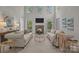 Bright living room with neutral walls, stone fireplace, and comfortable seating for relaxing or entertaining at 263 Fernbrook Dr, Mooresville, NC 28117