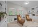 Bright and airy loft area with built-in bookshelves and seating, perfect for relaxing and unwinding at 263 Fernbrook Dr, Mooresville, NC 28117