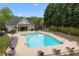 A spacious community pool with many chairs and tables for residents to enjoy during the summer at 263 Fernbrook Dr, Mooresville, NC 28117