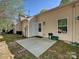 Backyard patio with a white door leading into the home at 2731 Meadow Knoll Dr, Charlotte, NC 28269
