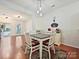Dining room showcases a table with chairs, area rug, and decorative coffee sign at 2731 Meadow Knoll Dr, Charlotte, NC 28269