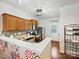 Well-lit kitchen featuring stainless steel appliances, wooden cabinets, and stone tile backsplash at 2731 Meadow Knoll Dr, Charlotte, NC 28269