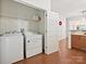 Laundry room with white washer and dryer units, and door to hallway at 2731 Meadow Knoll Dr, Charlotte, NC 28269