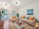 Living room furnished with a sofa, armchairs, rug, and view of the entry at 2731 Meadow Knoll Dr, Charlotte, NC 28269