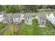 An aerial view of modern homes with light siding, green grass and fenced backyards at 2821 Shamrock Dr, Charlotte, NC 28205